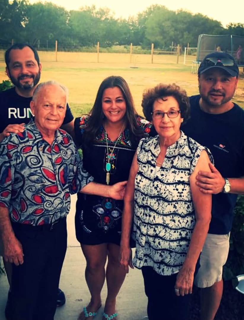 Karla outdoors with her parents and brothers